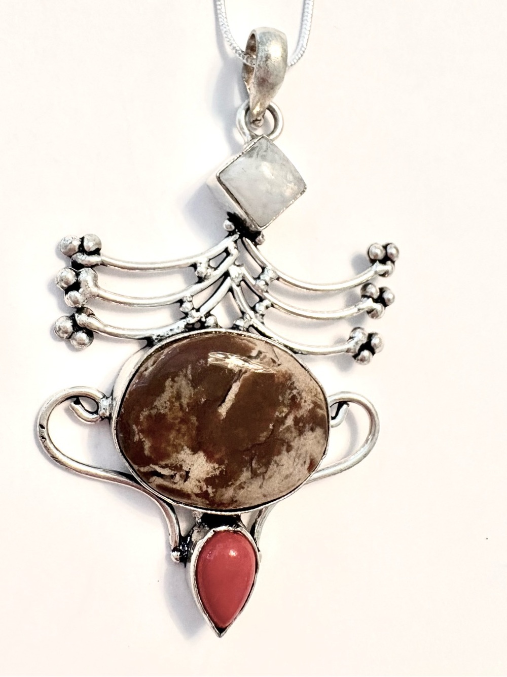 2 1/2 inch, 925 marked, Jasper, Coral and Moonstone  pendant on a silver chain.